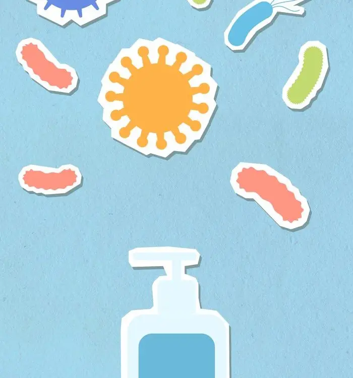 Paper cutout of antiseptic bottle for skin care and preventing disease on blue background with abundance of dangerous types of viruses